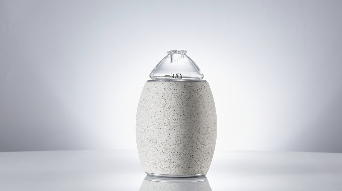 Minimalist aromatherapy gift set featuring concrete diffuser and essential oils