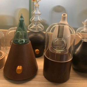 glass & wood nebulizing diffusers on table